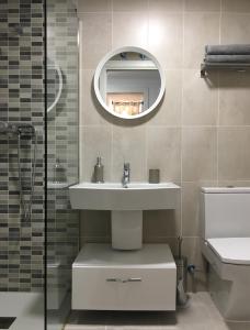 a bathroom with a sink and a mirror at Apartment Santa Teresa in Altea +6 photos