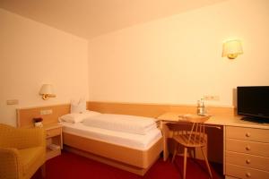 Posteľ alebo postele v izbe v ubytovaní Hotel la Plaza