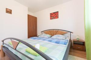 Postel nebo postele na pokoji v ubytování Apartments Karen