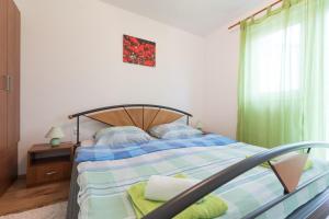 Postel nebo postele na pokoji v ubytování Apartments Karen
