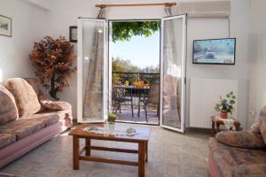 a living room with a couch and a table at Summer Dream in Vlachata