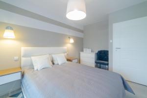 Posteľ alebo postele v izbe v ubytovaní DP Apartament Polanki Park