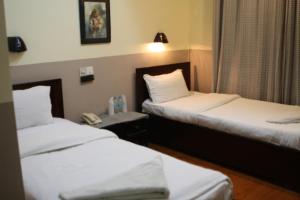 Letto o letti in una camera di Hotel Buddha Land