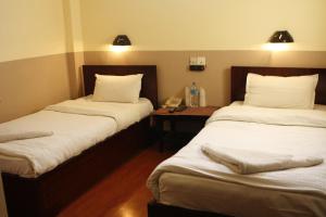 Letto o letti in una camera di Hotel Buddha Land