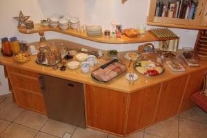 a kitchen counter with a lot of food on it at Feldlhof in Schladming
