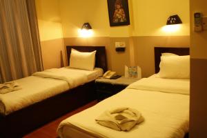 Letto o letti in una camera di Hotel Buddha Land