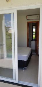 Ένα ή περισσότερα κρεβάτια σε δωμάτιο στο Apartamento 3 Quartos Tree Bies Resort Subauma