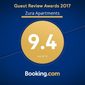 un círculo amarillo con las palabras "Memoria de los invitados" premia a los apartamentos zermir en Zura Apartments, en Ohrid