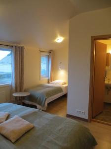 Voodi või voodid majutusasutuse Guesthouse Vellir toas