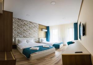 Postel nebo postele na pokoji v ubytování Monopoly Hotel + 37 fotografií