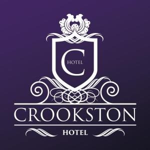 a blue and white sign on a white wall at Crookston Hotel in Glasgow