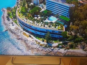 a television screen with a model of a resort at Bordighera Fivestar in Bordighera
