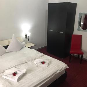 Postel nebo postele na pokoji v ubytování Casa Ghetu Fundeni
