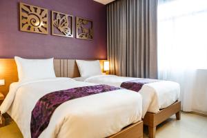 Posteľ alebo postele v izbe v ubytovaní Asialink Easy by Prasanthi