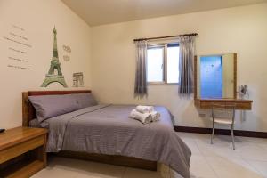 Postel nebo postele na pokoji v ubytování Jia Xiang Lin Guan Hai Homestay