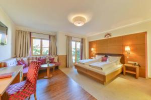 Ein Bett oder Betten in einem Zimmer der Unterkunft Posthotel Hofherr