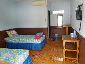 Кровать или кровати в номере Baan Khunta Resort