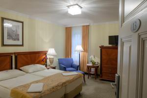 Postel nebo postele na pokoji v ubytování Hotel Villa Huber