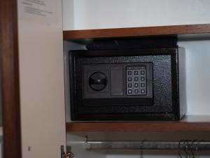 a black and white microwave sitting on top of a wooden cabinet at Hotelboat Sarah in Amsterdam