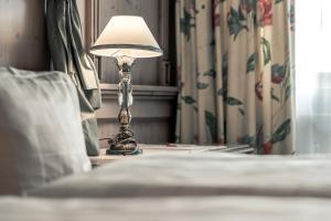 En eller flere senge i et værelse på Hotel Jagdhof Bed & Breakfast