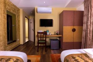 Letto o letti in una camera di Bodhi Boutique Hotel