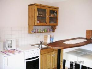 a kitchen with a sink and a counter top at FH Charlottchen_WEIG in Ostseebad Karlshagen