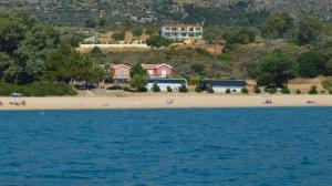 a view of a beach with people on the sand at Summer Sun in Skala