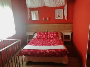 מיטה או מיטות בחדר ב-APARTAMENTOS MELCHOR DE LIÑAN