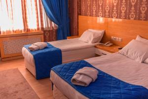 Posteľ alebo postele v izbe v ubytovaní Pera City Hotel + 58 fotografií