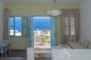 a living room with a view of the ocean at Aeri in Chora Folegandros