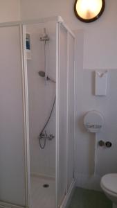 a bathroom with a shower and a toilet at MillePini in Calatafimi +26 photos