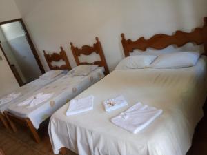 Säng eller sängar i ett rum på Pousada Pantanal