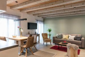 a living room with a couch and a table at Doris' Nest in Kitzbühel