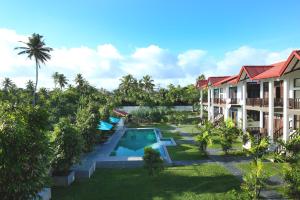 an aerial view of a resort with a swimming pool at Kaminrich Cottage in Matara