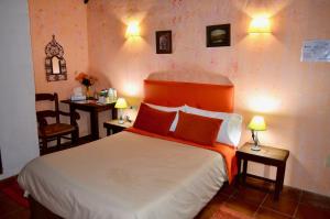 Postel nebo postele na pokoji v ubytování Hotel Restaurante Bandolero