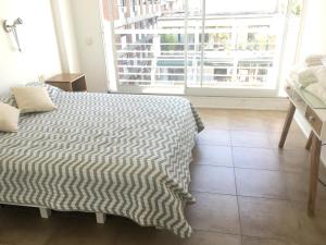 Uma cama ou camas num quarto em My Place apartamentos - BELGRANO