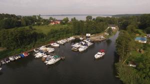 an aerial view of boats docked in a river at Lenzer Hafen in Lenz