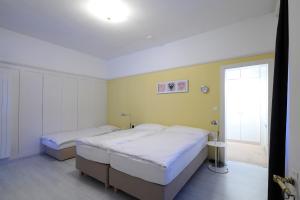 Postel nebo postele na pokoji v ubytování Hotel Concordia