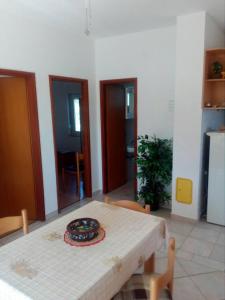 a room with a table with a plate on it at Apartments Irena in Božava
