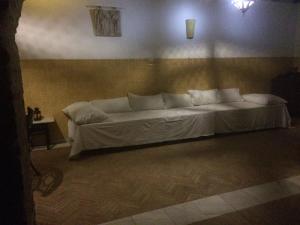 Łóżko lub łóżka w pokoju w obiekcie Hacienda Los Jinetes