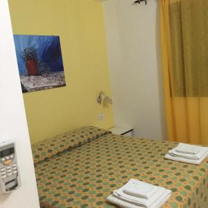 Postel nebo postele na pokoji v ubytování Residence Punta Sottile Lampedusa 150 mt dalla spiaggia cala francese