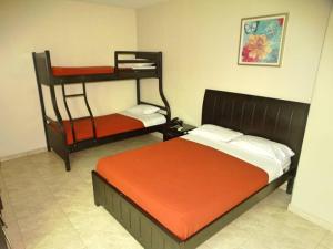 Voodi või voodid majutusasutuse Hotel Marvento II toas