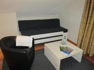 Ein Sitzbereich in der Unterkunft Hotel Schlafschön