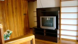 a television sitting on a stand in a room at Hotel Laguna in Bocas Town