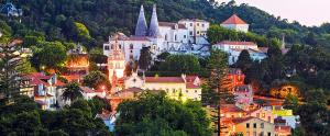 a town on top of a hill with a castle at Palheiro AL in Sintra