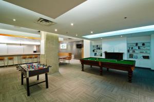 a room with a pool table and a bar at Chestnut Residence and Conference Centre - University of Toronto in Toronto