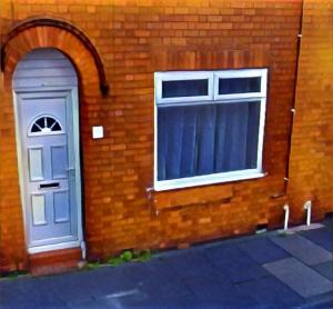 a brick building with a door and a window at Royle House by SG Property Group in Northwich +3 photos