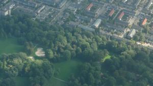 an overhead view of a river with trees and buildings at B&B Aan het Park Eindhoven in Eindhoven