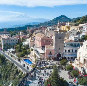 an aerial view of a city with a town at Taormina Terrace sea view in Taormina
