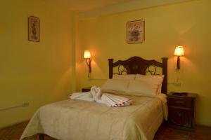 Un pat sau paturi într-o cameră la hotel MISKY PUÑUY - Valle del Sondondo